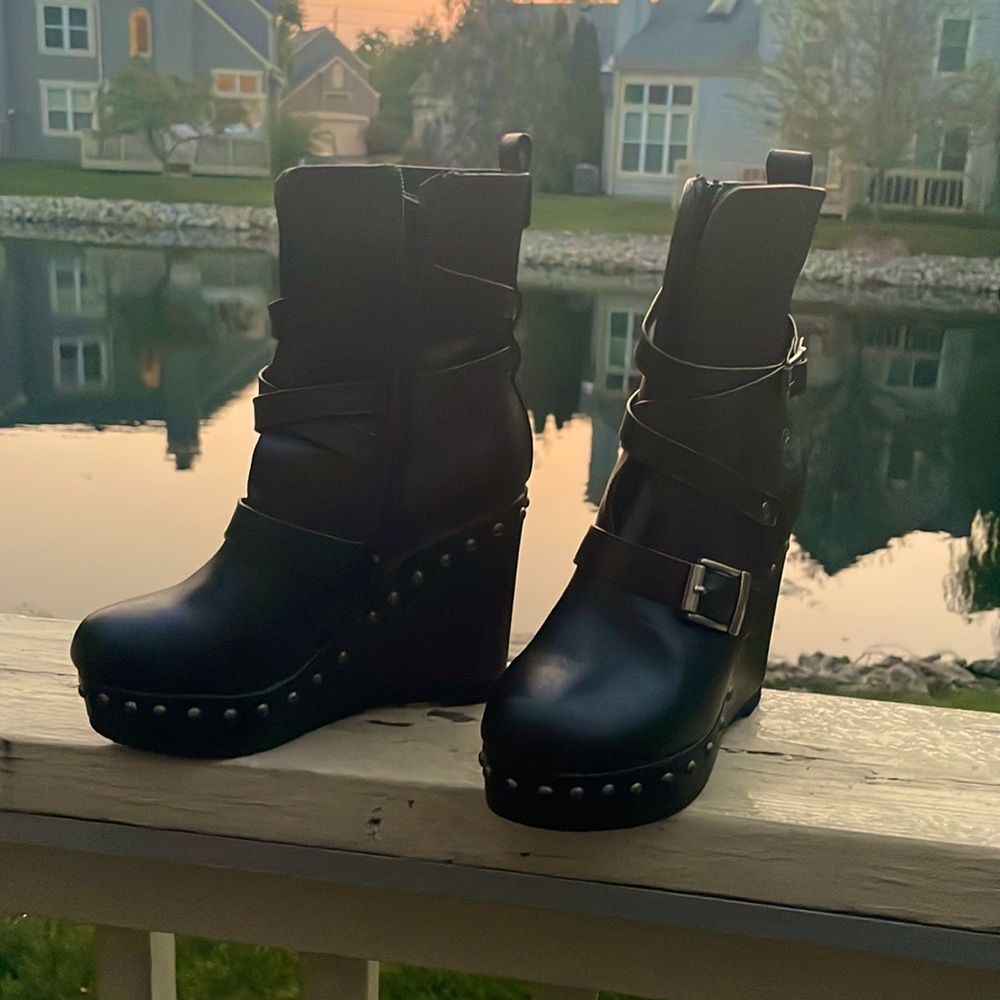 Black leather ankle wedge boots.